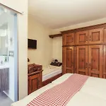 Le Petit Charme-inn Отель